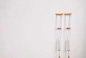 A pair of crutches leaning against a wall