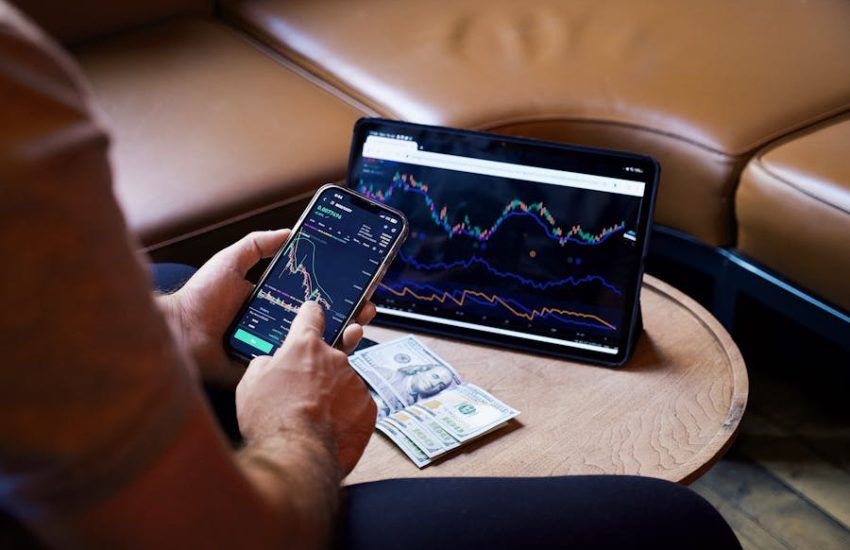 Photo by iam hogir: https://www.pexels.com/photo/man-looking-at-the-stock-charts-on-the-phone-and-tablet-17781647/